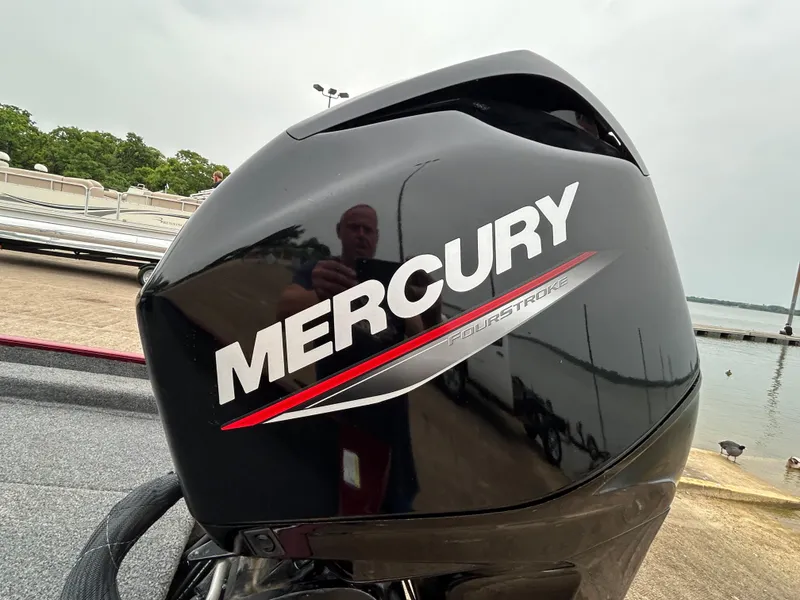 Slide: The Image of Mercury FourStroke engine on a 2022 Lowe Skorpion 17 boat, dockside view. - 22