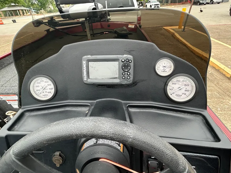 Slide: The Image of Dashboard of 2022 Lowe Skorpion 17 boat with gauges and Lowrance display. - 30
