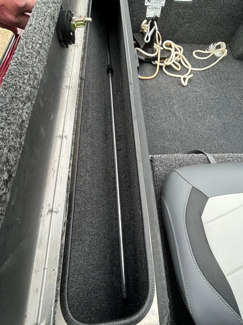 Slide: The Image of 2022 Lowe Skorpion 17 boat interior with storage compartment and seating. - 31