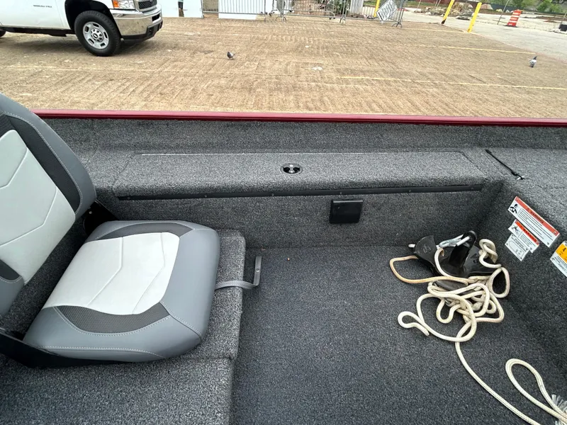 Slide: The Image of Interior of a 2022 Lowe Skorpion 17 boat with seating and rope. - 32