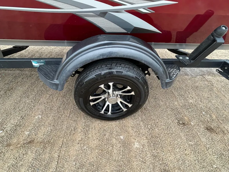 Slide: The Image of Trailer wheel of 2022 Lowe Skorpion 17 boat with stylish black alloy rim. - 37