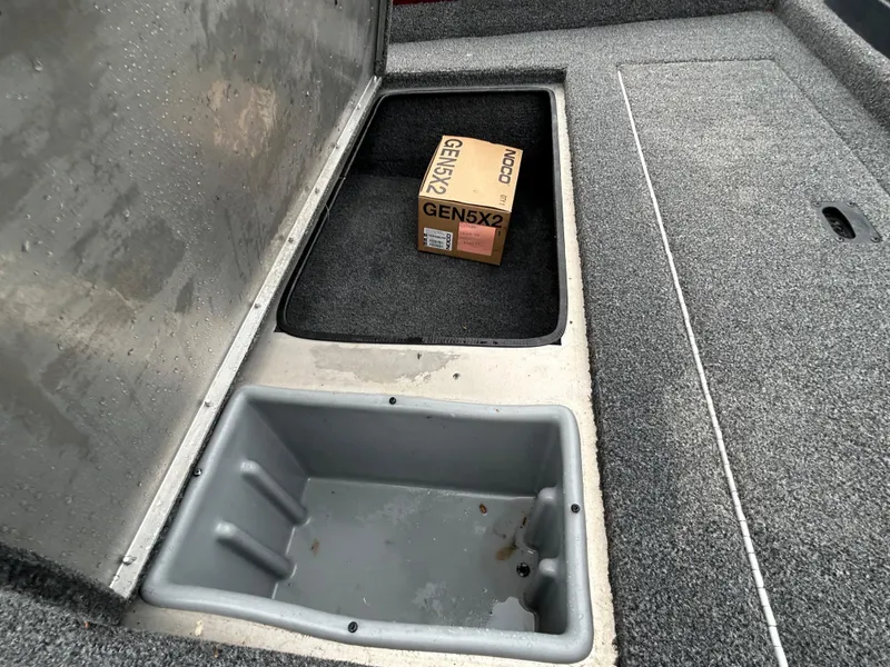 Slide: The Image of 2022 Lowe Skorpion 17 boat storage compartments with a NOCO GEN5X2 box inside. - 41