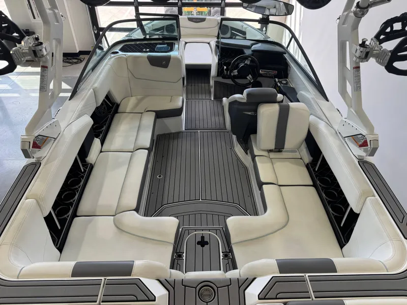 Slide: The Image of 2019 Nautique Super Air Nautique GS22 interior with white seating and sleek design. - 11