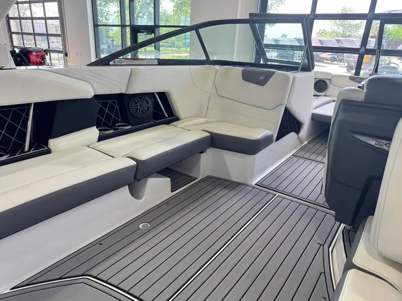 Slide: The Image of 2019 Nautique Super Air Nautique GS22 interior with sleek seating and modern design. - 12