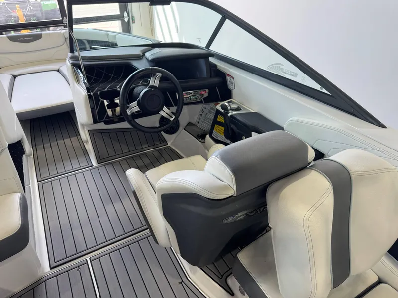 Slide: The Image of 2019 Nautique Super Air Nautique GS22 interior with sleek design and modern dashboard. - 22