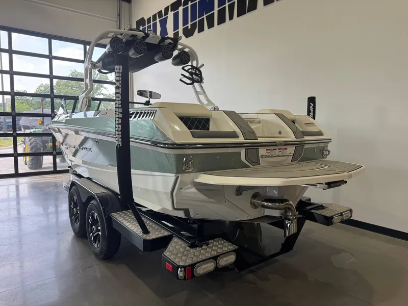 Slide: The Image of 2019 Nautique Super Air Nautique GS22 boat on trailer in showroom. - 5