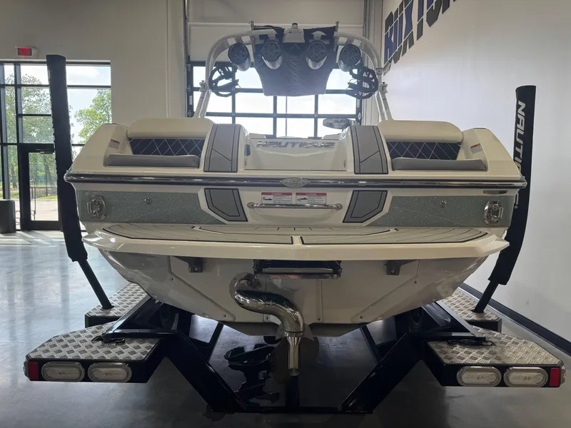Slide: The Image of 2019 Nautique Super Air Nautique GS22 boat on trailer in showroom. - 6