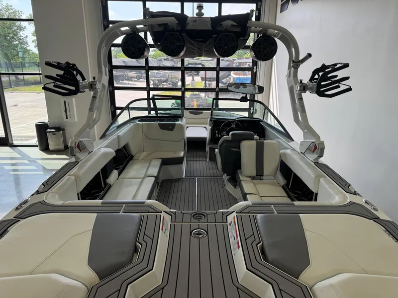Slide: The Image of 2019 Nautique Super Air Nautique GS22 interior with sleek seating and advanced audio system. - 7
