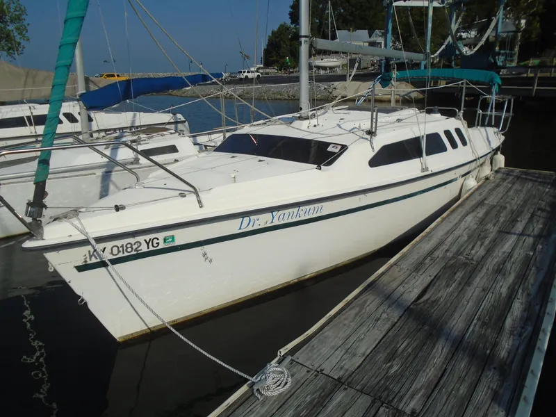 Slide: The Image of 1996 Hunter 23.5 sailboat docked at marina, sunny day. - 0
