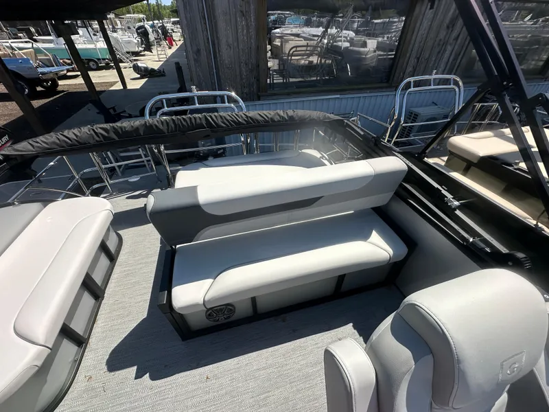 Slide: The Image of 2025 Godfrey Sweetwater 2286 SFLC boat interior with gray seating and modern design. - 10