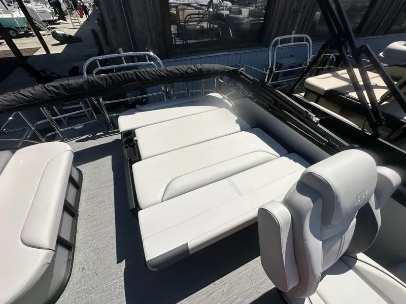 Slide: The Image of 2025 Godfrey Sweetwater 2286 SFLC boat interior with comfortable seating and modern design. - 12