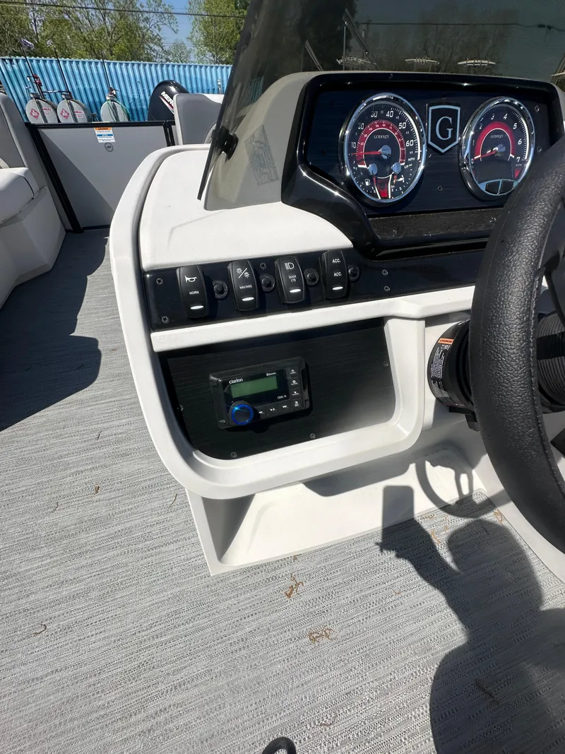 Slide: The Image of 2025 Godfrey Sweetwater 2286 SFLC boat dashboard with gauges and controls. - 17