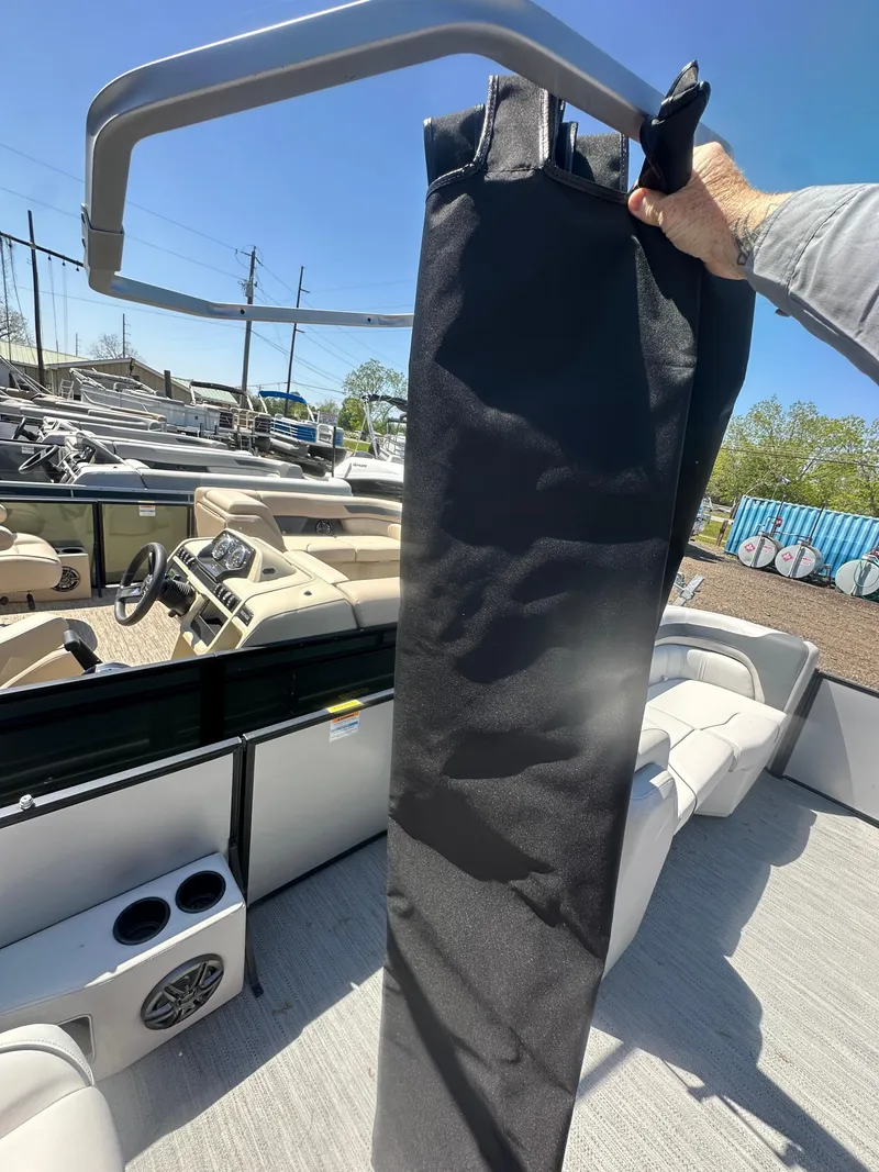 Slide: The Image of 2025 Godfrey Sweetwater 2286 SFLC boat interior with speaker and canopy detail. - 20