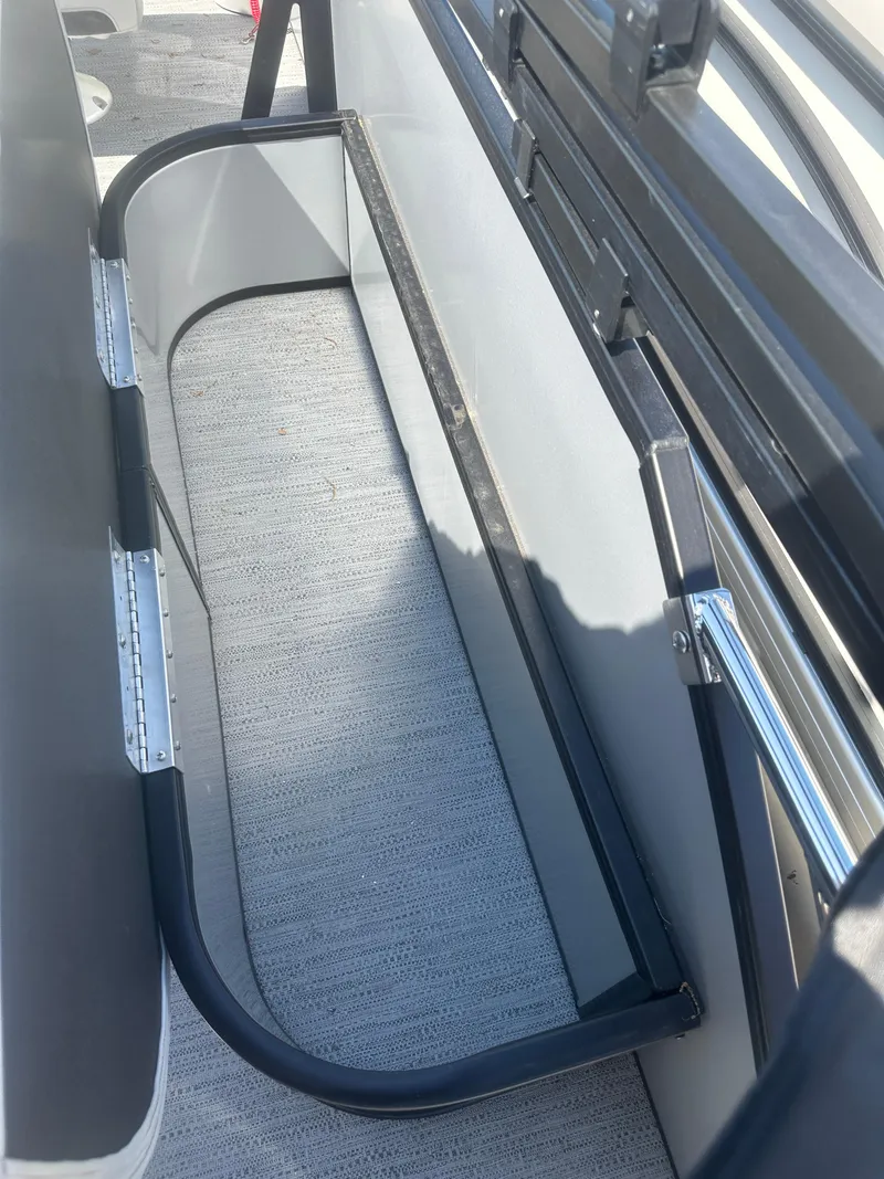 Slide: The Image of Interior view of 2025 Godfrey Sweetwater 2286 SFLC boat, featuring seating and railing. - 25