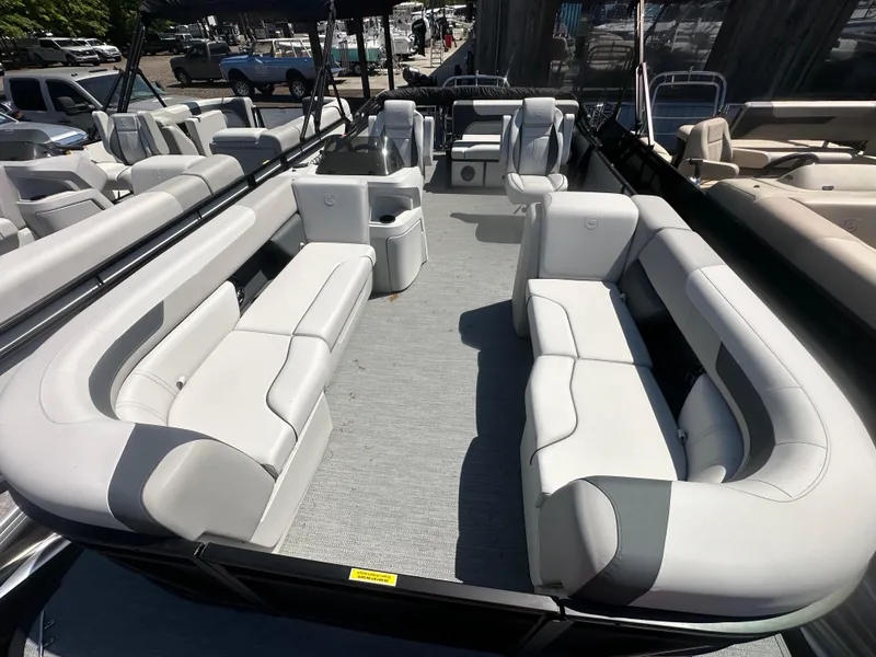 Slide: The Image of 2025 Godfrey Sweetwater 2286 SFLC pontoon boat with spacious seating and modern design. - 7