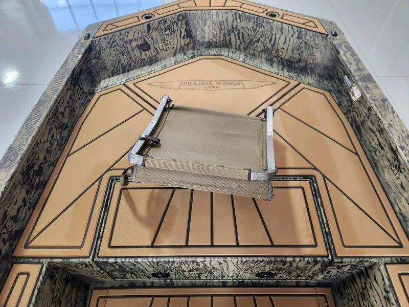 Slide: The Image of 2025 Tracker Grizzly 1650 T Prairie Wings Edition boat interior with camo design and seating. - 7