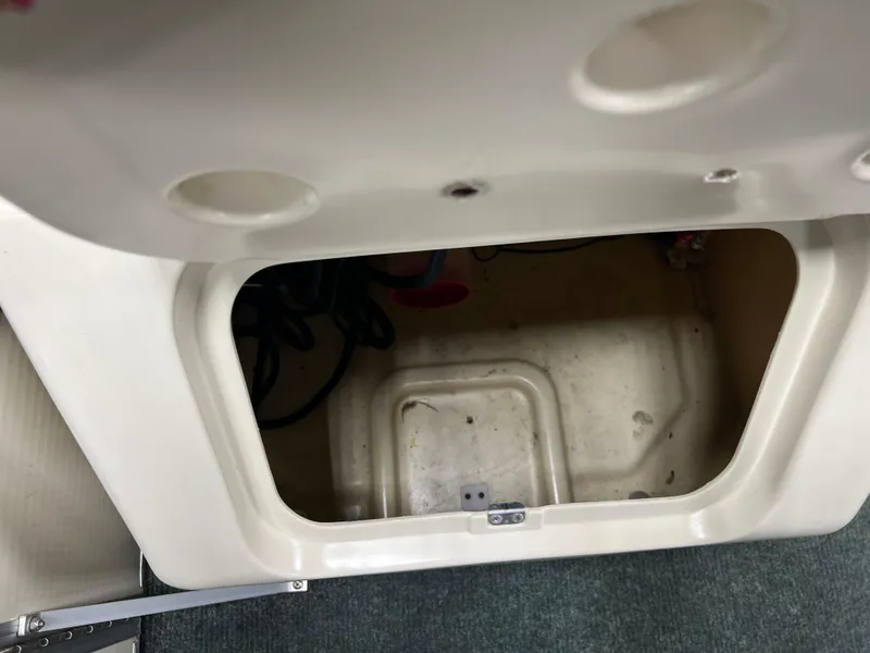 Slide: The Image of Open storage compartment in a 2008 Sweetwater 2386 RE boat. - 10