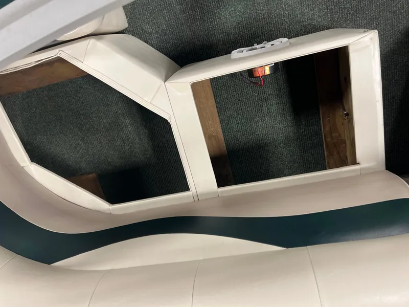 Slide: The Image of Interior seating of 2008 Sweetwater 2386 RE boat with storage compartments. - 14