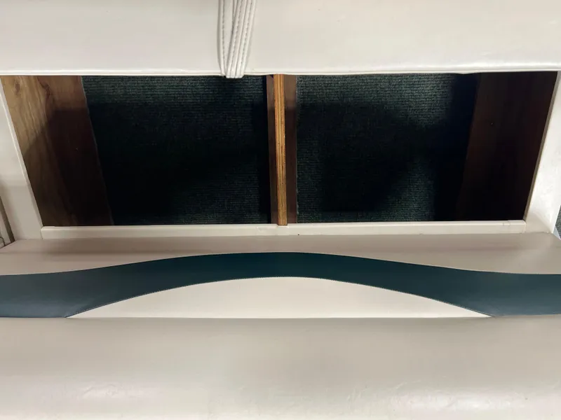 Slide: The Image of Interior view of a 2008 Sweetwater 2386 RE boat seat with storage compartment. - 15