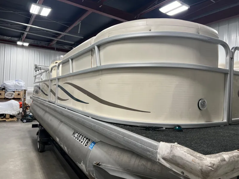 Slide: The Image of 2008 Sweetwater 2386 RE pontoon boat in indoor storage facility. - 3