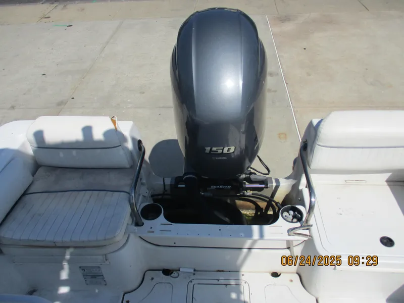 Slide: The Image of 2007 Triumph 21 Center Console boat with Yamaha 150 engine, rear seating view. - 15
