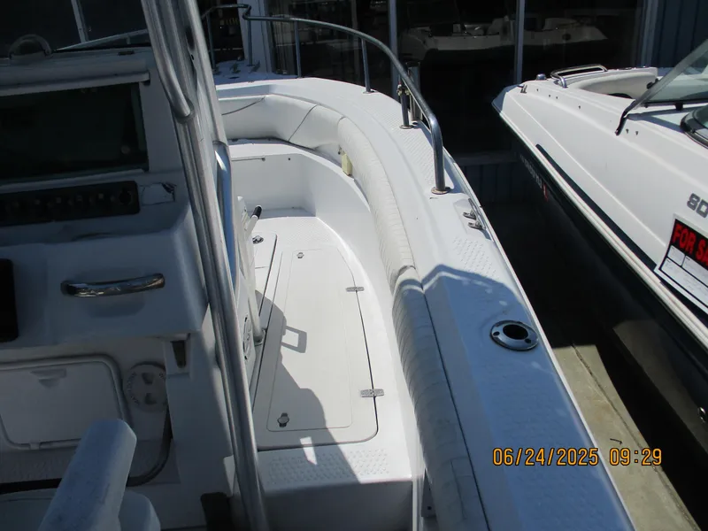 Slide: The Image of 2007 Triumph 21 Center Console boat interior with seating and storage. - 18