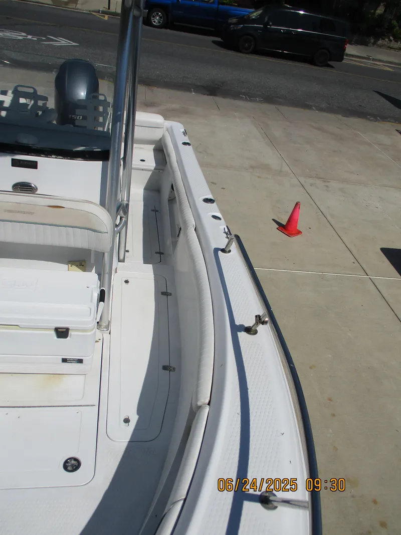 Slide: The Image of 2007 Triumph 21 Center Console boat docked on concrete surface. - 25