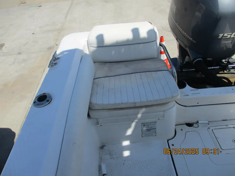 Slide: The Image of 2007 Triumph 21 Center Console boat with Yamaha 150 engine, featuring white seating. - 27