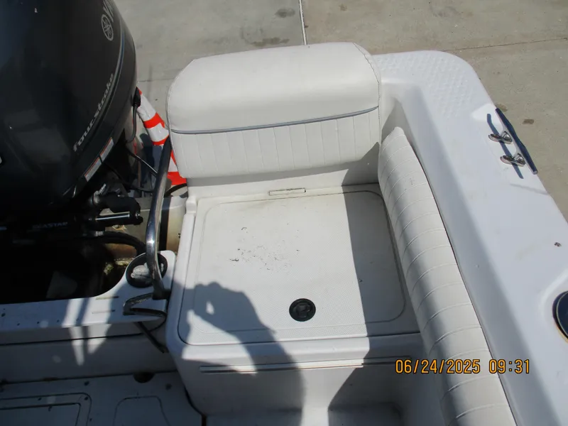 Slide: The Image of 2007 Triumph 21 Center Console boat seating area with Yamaha outboard motor. - 28