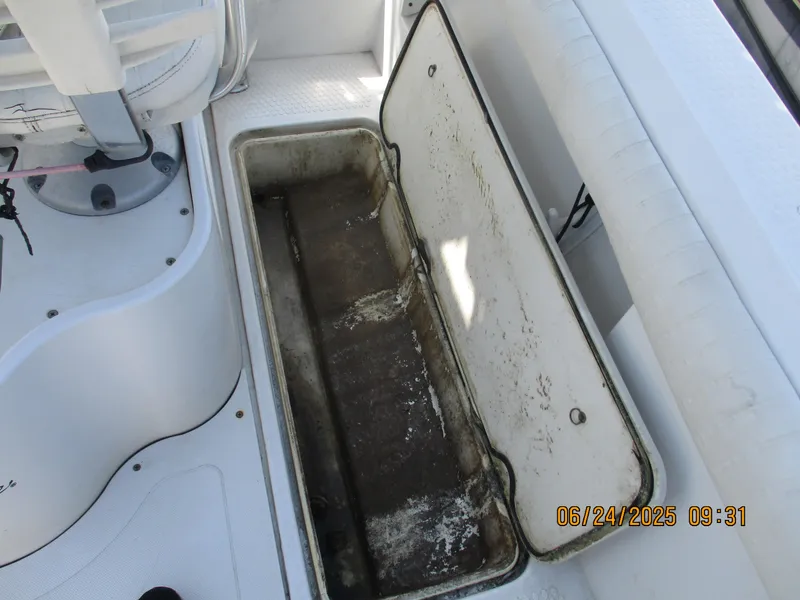 Slide: The Image of Open storage compartment on 2007 Triumph 21 Center Console boat deck. - 29