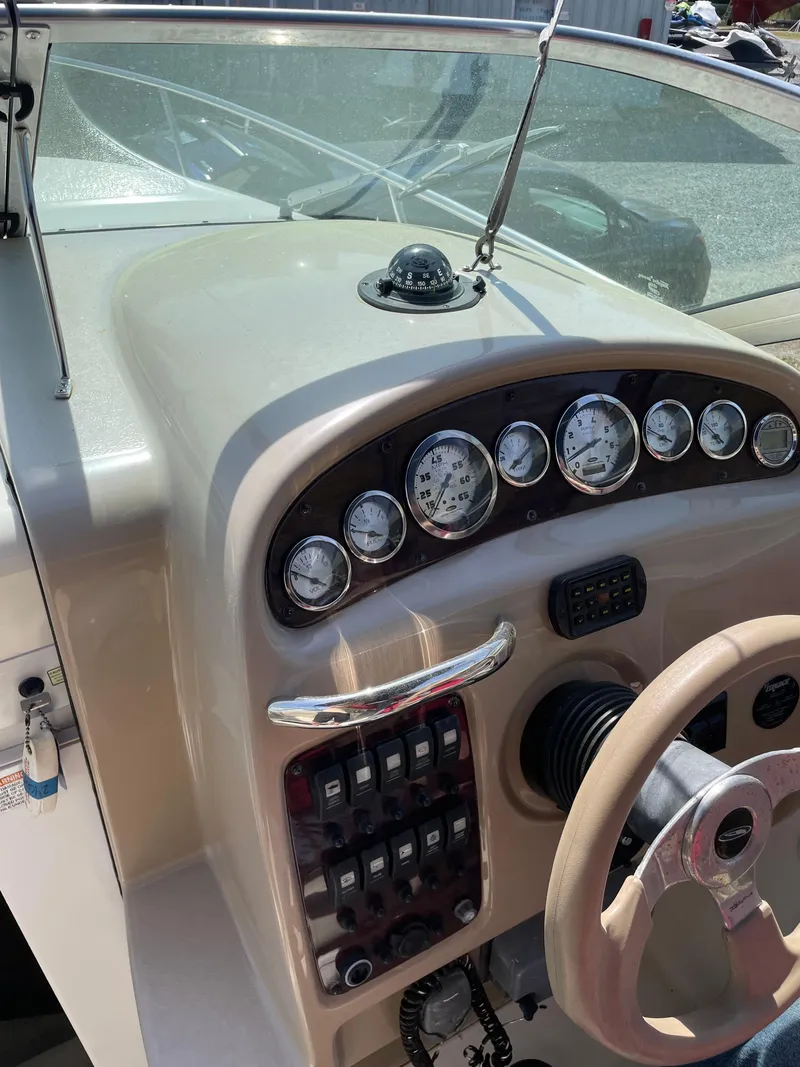 Slide: The Image of 2004 Chaparral Signature 240 dashboard with gauges and steering wheel. - 13