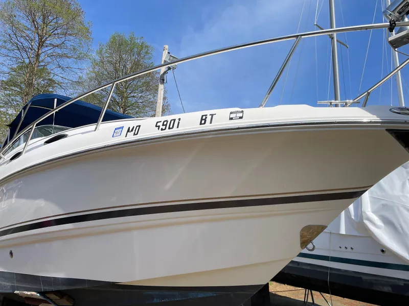 Slide: The Image of 2004 Chaparral Signature 240 boat on trailer, side view with registration number visible. - 5