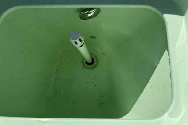 Slide: The Image of A green sink basin with a central drain and faucet, Custom Vernese V23, 2021 model. - 19