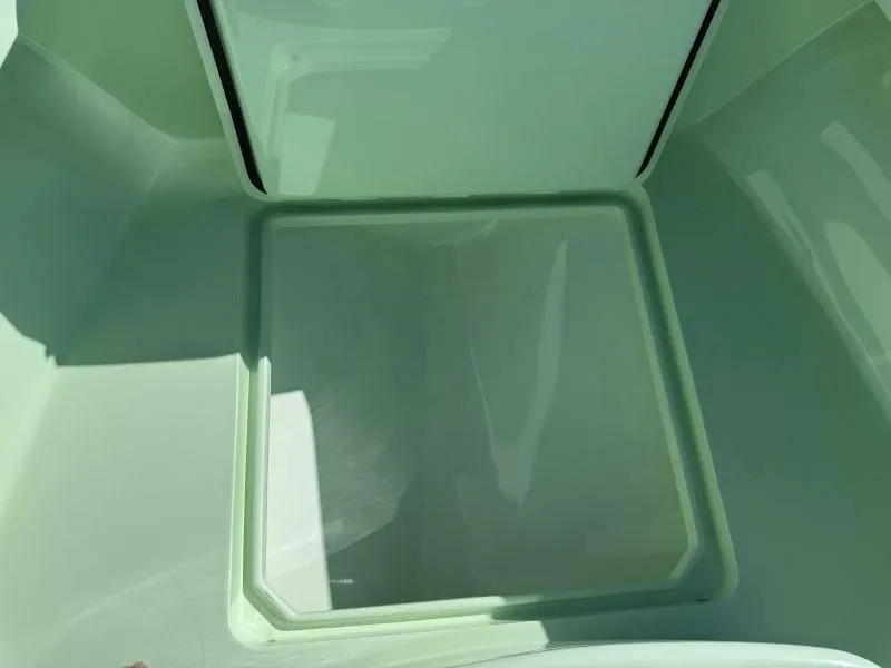 Slide: The Image of Open storage compartment in a 2021 Custom Vernese V23 boat. - 21
