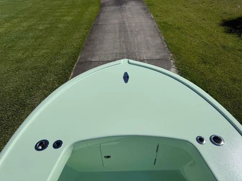 Slide: The Image of Bow of Custom Vernese V23 boat on grassy path, 2021 model. - 24