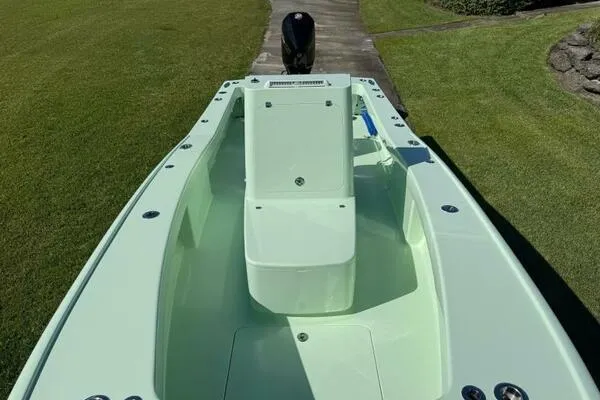 Slide: The Image of Custom Vernese V23 boat, 2021 model, light green deck, outdoor setting. - 4