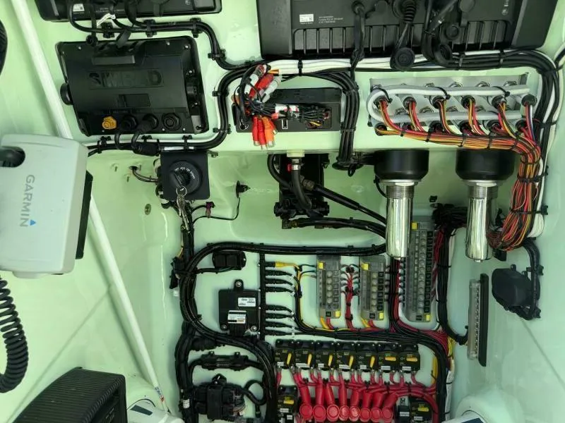 Slide: The Image of Electrical system of a 2021 Custom Vernese V23 boat with organized wiring and components. - 9