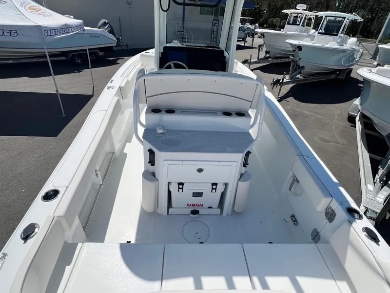 Slide: The Image of 2025 Sea Hunt Ultra 235 SE boat interior with seating and storage. - 2