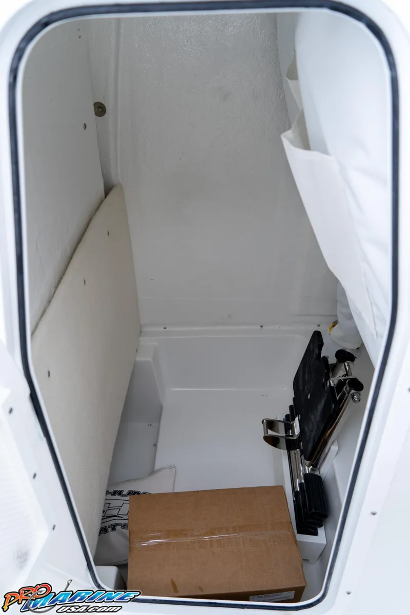 Slide: The Image of Interior storage compartment of 2025 Sea Hunt Ultra 235 SE boat. - 6