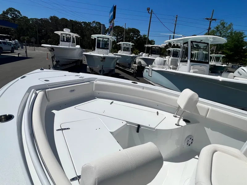 Slide: The Image of 2025 Sea Hunt Ultra 235 SE boat interior, showcasing spacious seating and sleek design. - 7