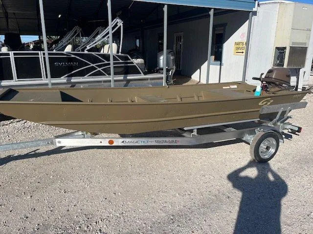Slide: The Image of 2025 G3 Gator Tough 1544 LW boat on trailer, parked outdoors. - 5
