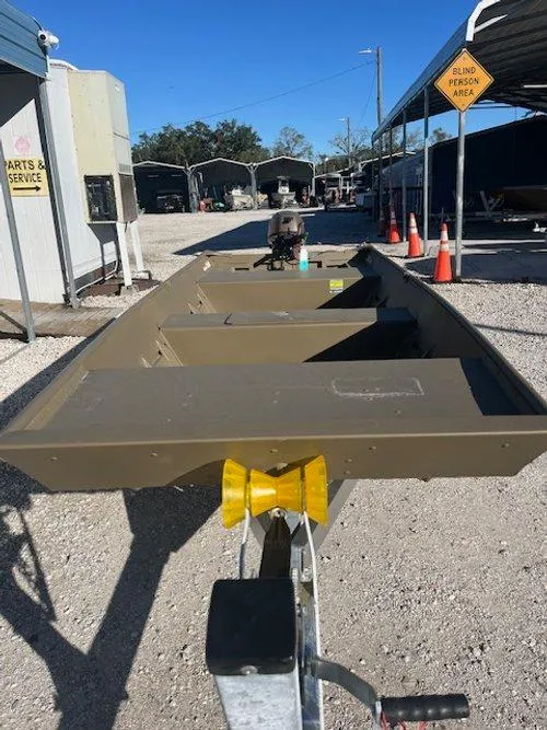 Slide: The Image of 2025 G3 Gator Tough 1544 LW boat on trailer in outdoor storage area. - 7