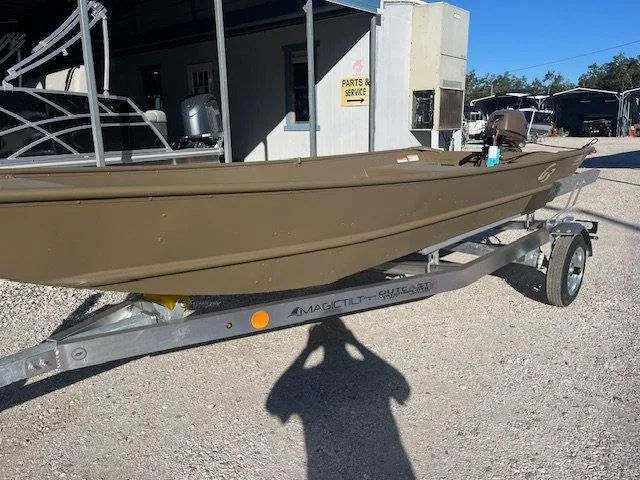 Slide: The Image of 2025 G3 Gator Tough 1544 LW boat on trailer in outdoor setting. - 9