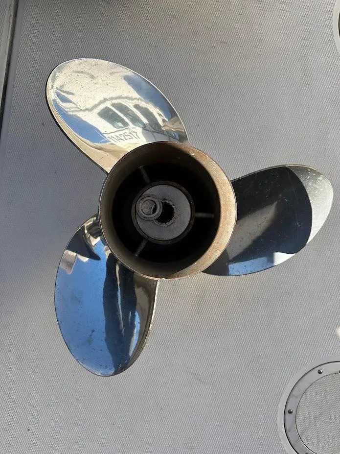 Slide: The Image of Close-up of a shiny boat propeller on a 2022 Grady-White Express 330. - 11