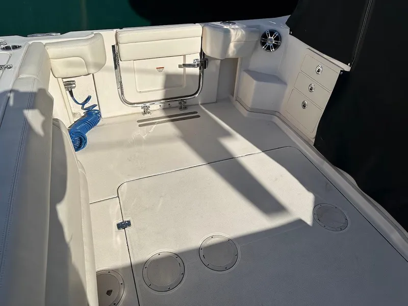 Slide: The Image of 2022 Grady-White Express 330 boat interior with seating and storage compartments. - 13
