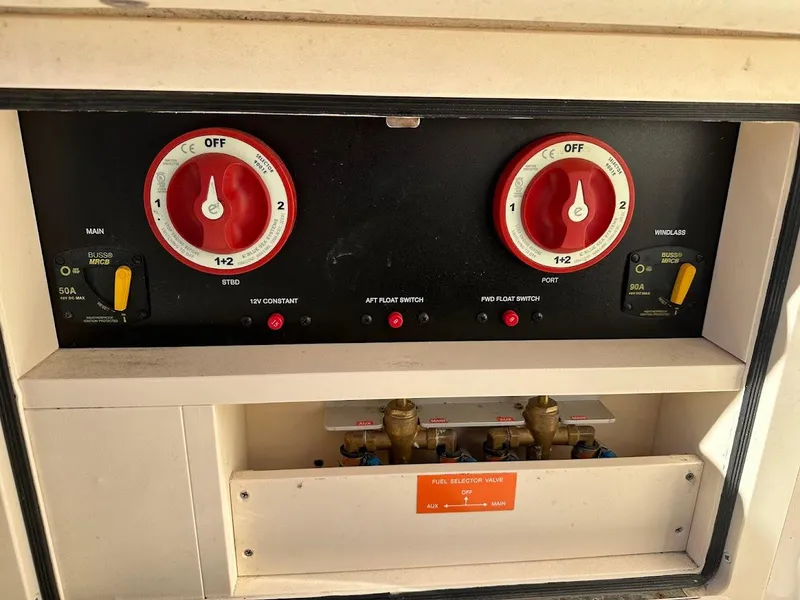 Slide: The Image of Electrical panel of a 2022 Grady-White Express 330 boat with dual battery switches. - 16