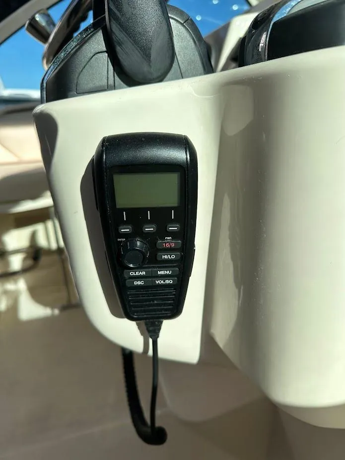 Slide: The Image of VHF radio on 2022 Grady-White Express 330 boat dashboard. - 22