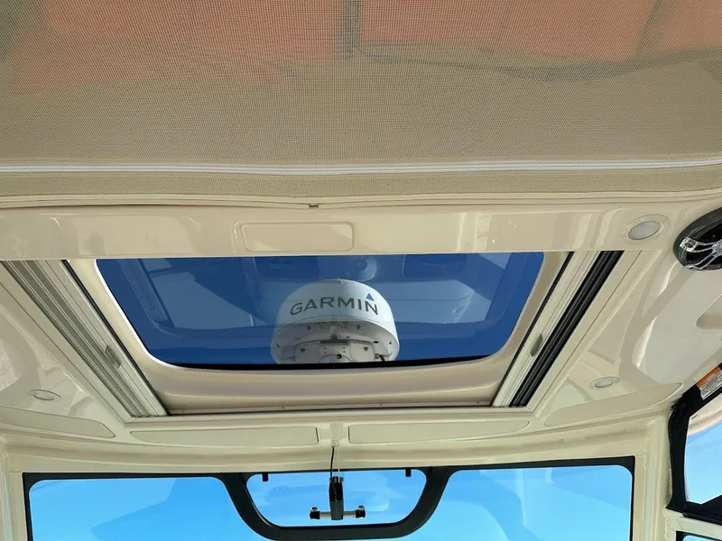 Slide: The Image of 2022 Grady-White Express 330 boat interior with Garmin radar visible through sunroof. - 27