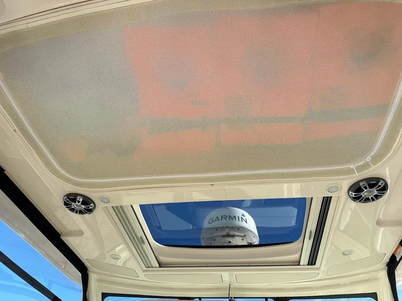 Slide: The Image of 2022 Grady-White Express 330 boat interior with Garmin radar and sunroof. - 28