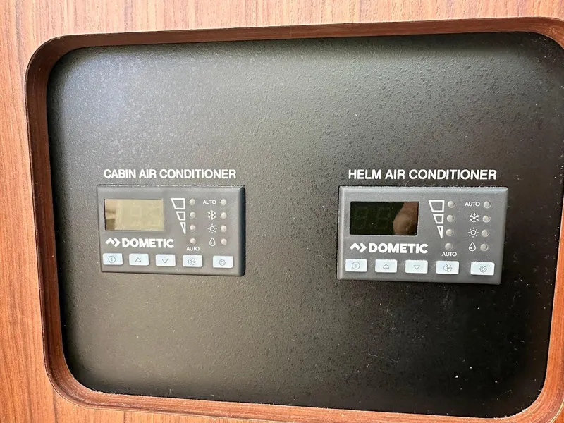 Slide: The Image of Dometic air conditioner controls on 2022 Grady-White Express 330 boat panel. - 30